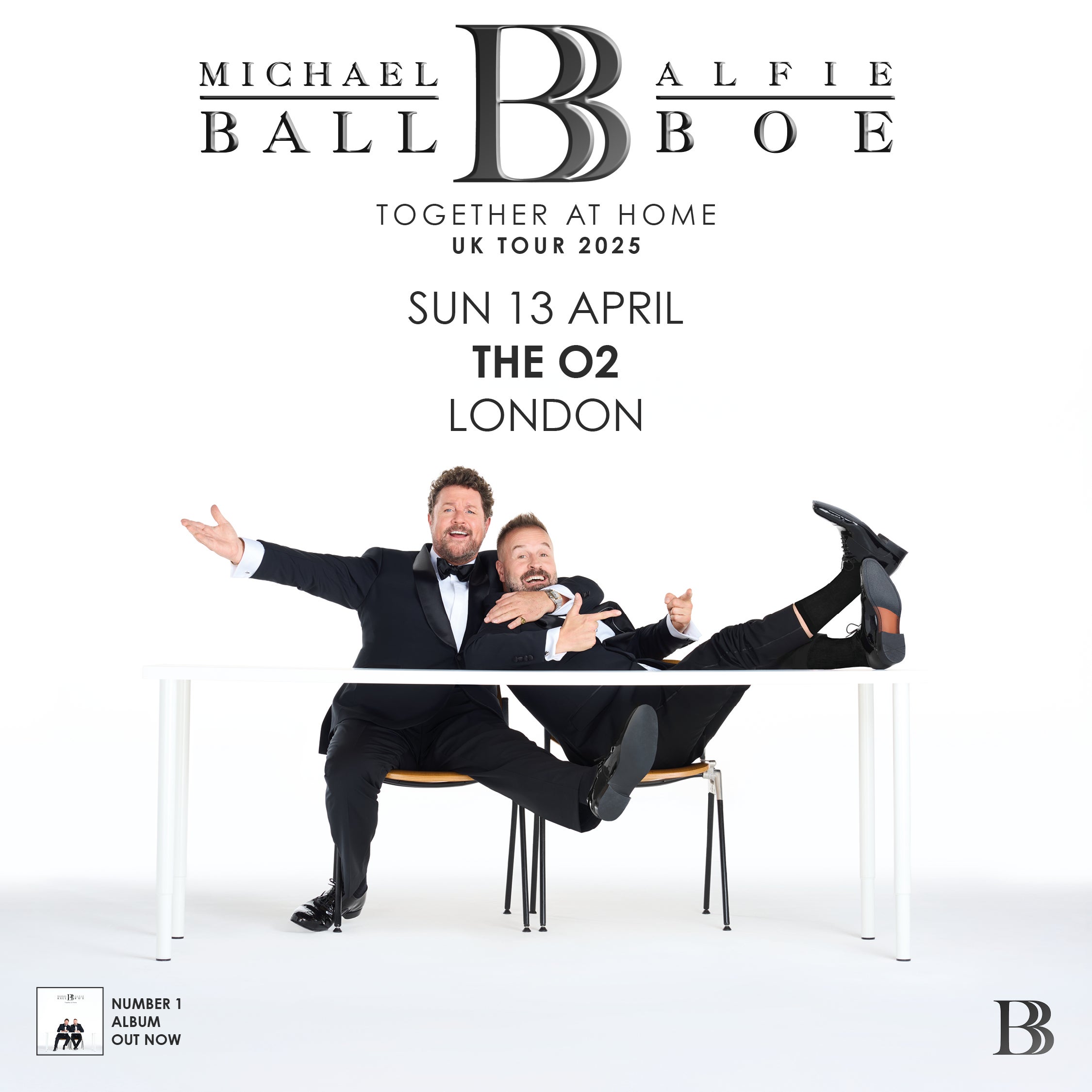 Promotional poster for Michael Ball and Alfie Boe's "Together at Home" UK Tour at The O2 in London. The image features the duo dressed in tuxedos, playfully posing around a white table against a white background. Their names and the tour title are displayed in elegant black text.