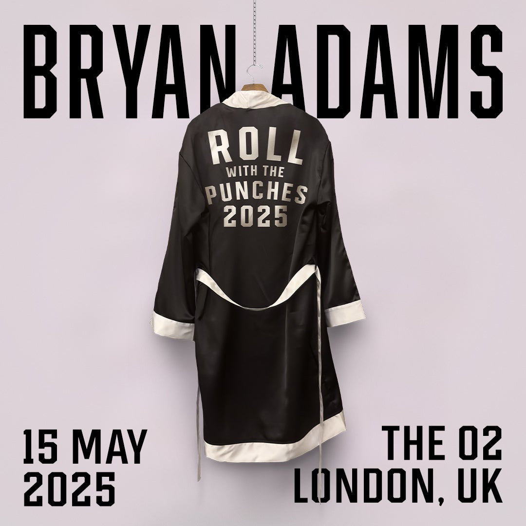 Promotional poster for Bryan Adams' "Roll With the Punches 2025" tour. A black satin boxing robe with silver lettering hangs on a hook, displaying the tour name. "Bryan Adams" is written in large, bold black letters in the background.