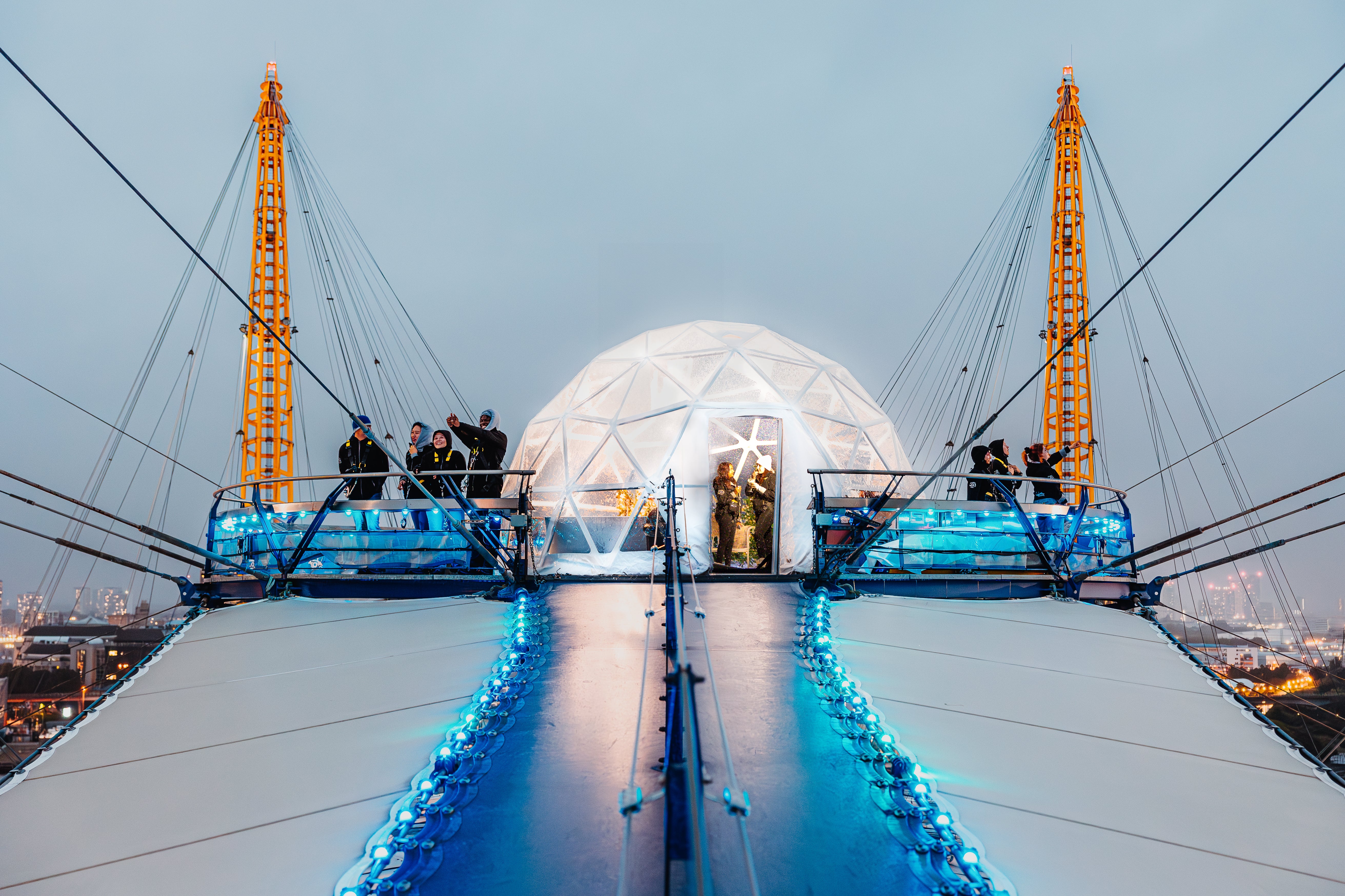 Image of snow globe activation on top of The O2 with people standing outside looking at the view from the top of building 