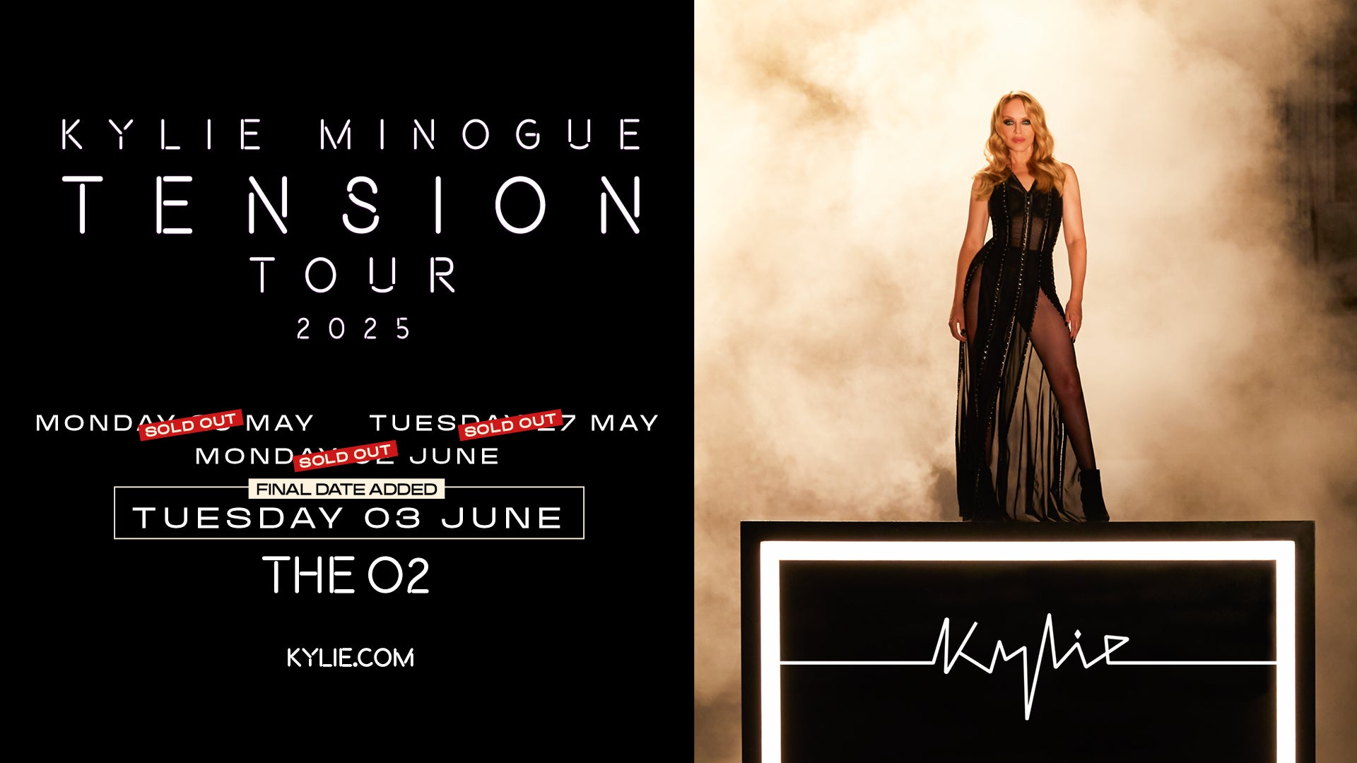 Image of Kylie Minogue standing on a black box saying 'Kylie' on a light marbled background 