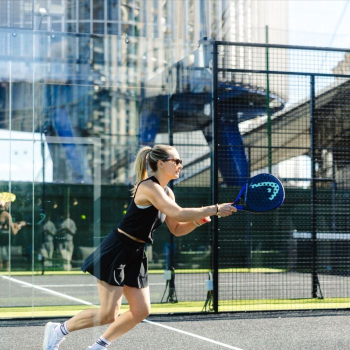 Woman playing padel