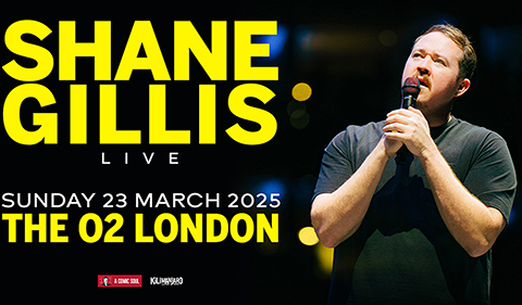 Promotional poster for comedian Shane Gillis' live show at The O2. The image features Shane Gillis on stage holding a microphone, with bold yellow and white text displaying event details.