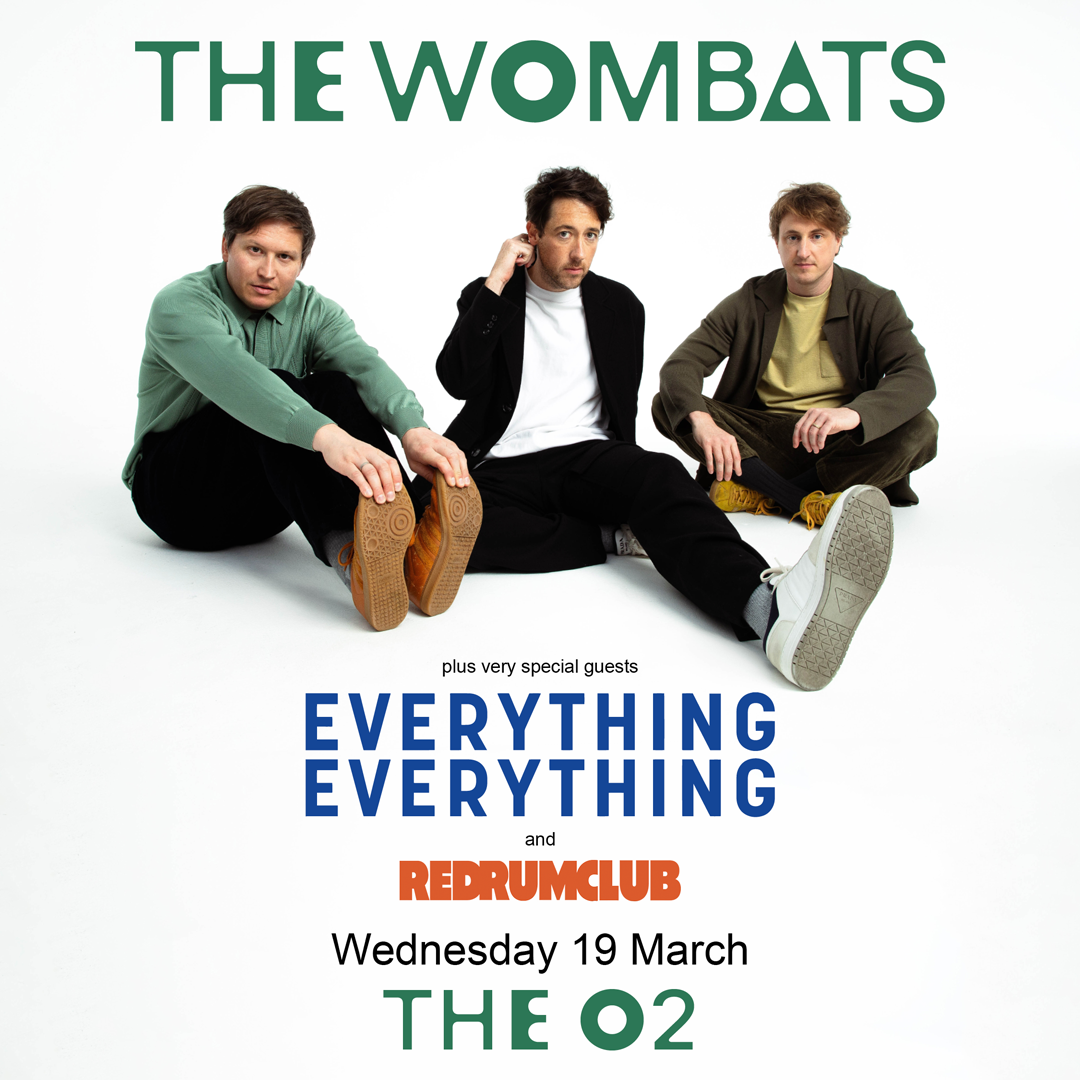 Promotional poster for The Wombats' concert featuring special guests Everything Everything and Red Rum Club. The band members are sitting on a white background with the event details, including the date (Wednesday, 19 March) and venue (The O2), displayed in bold green, blue, and orange text.