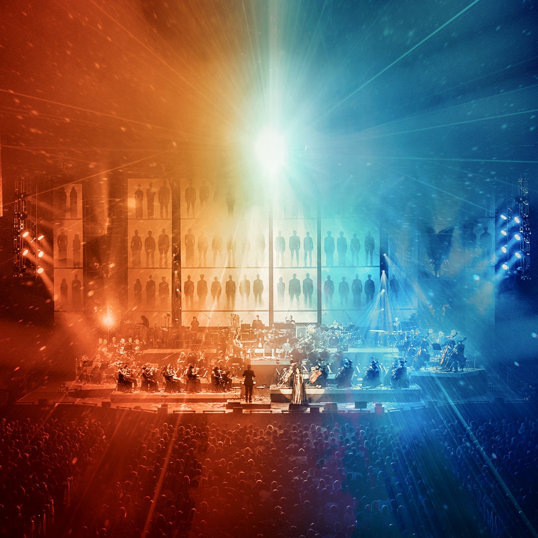 Concert poster for 'The World of Hans Zimmer: A New Dimension,' featuring a cinematic background with warm and cool lighting.